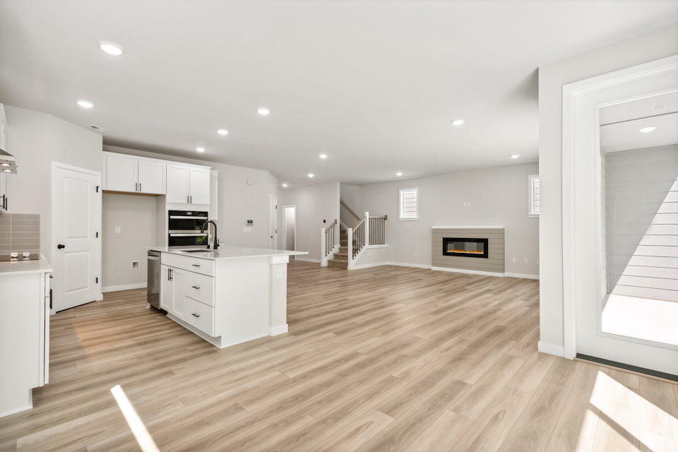 A large kitchen with white cabinets.