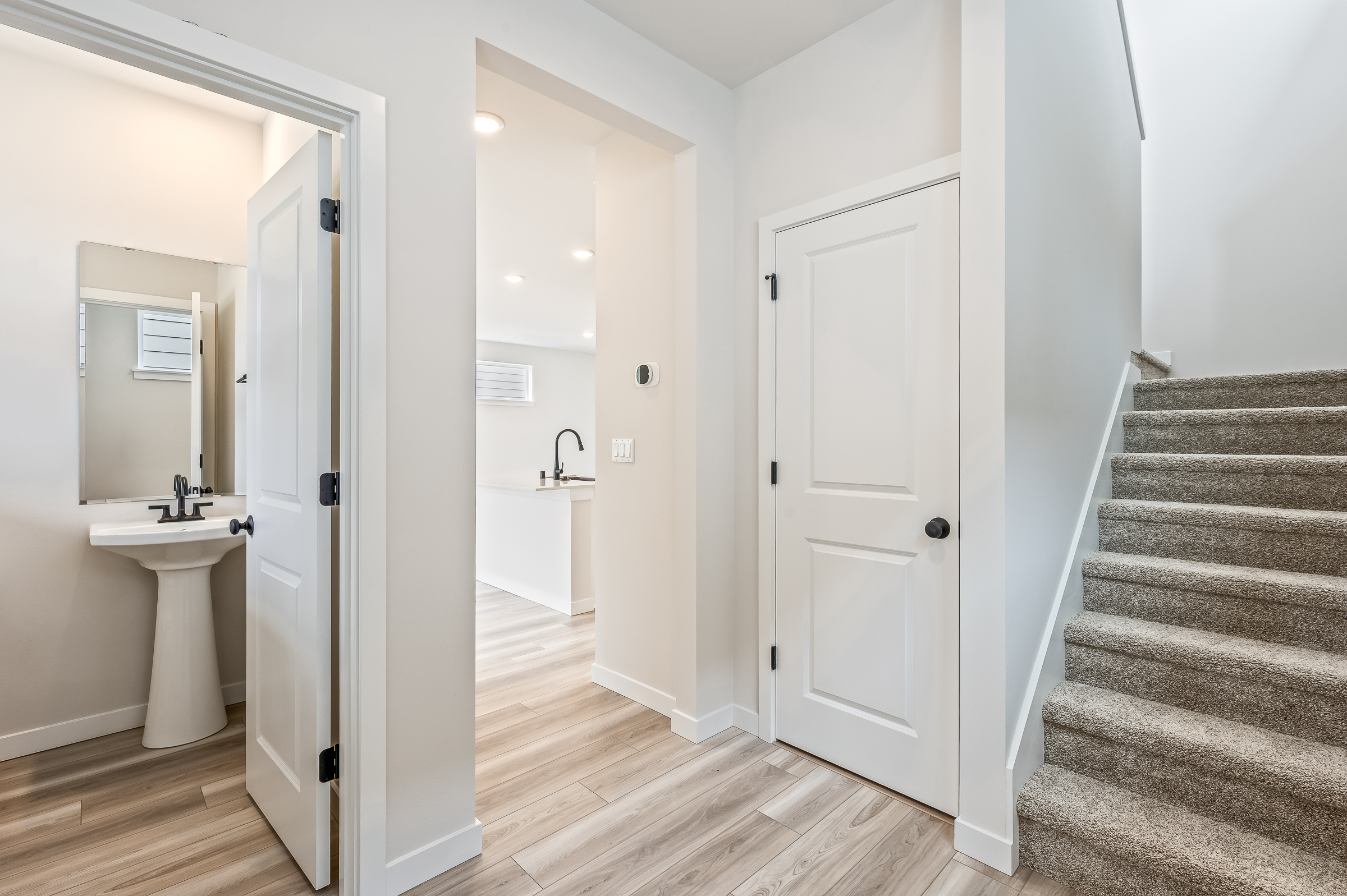 A bathroom with white walls.