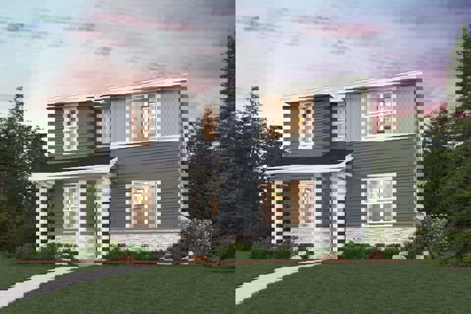 A house with a lawn and trees.