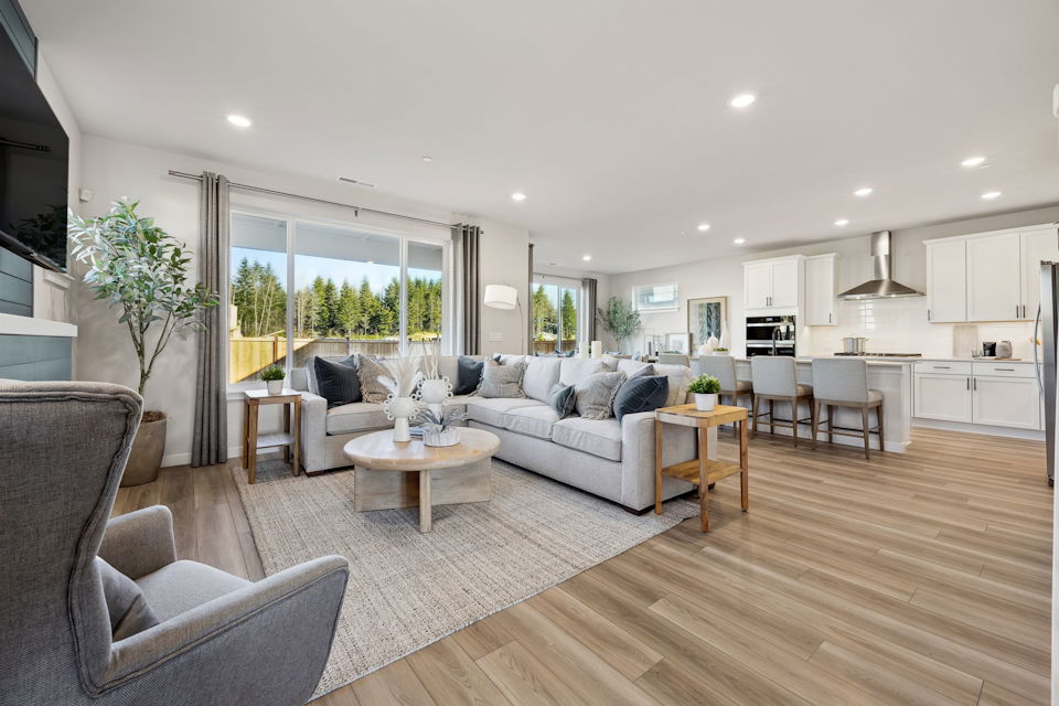 A large living room with a large window.