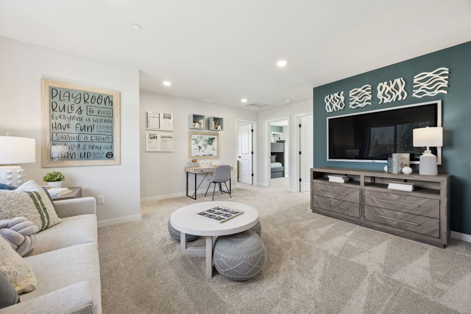 A living room with a tv and couches.