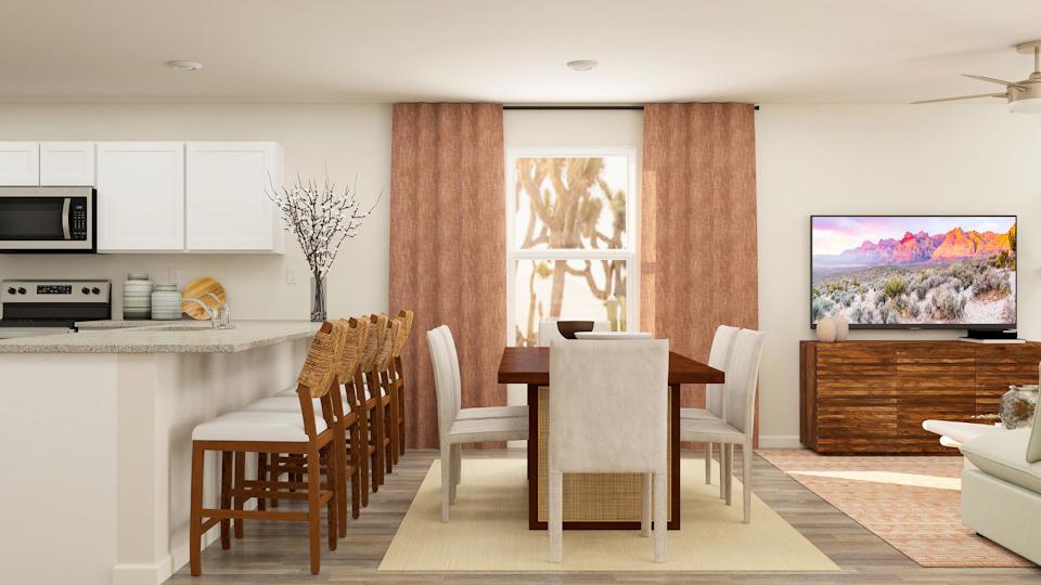 A living room with a dining table and chairs.