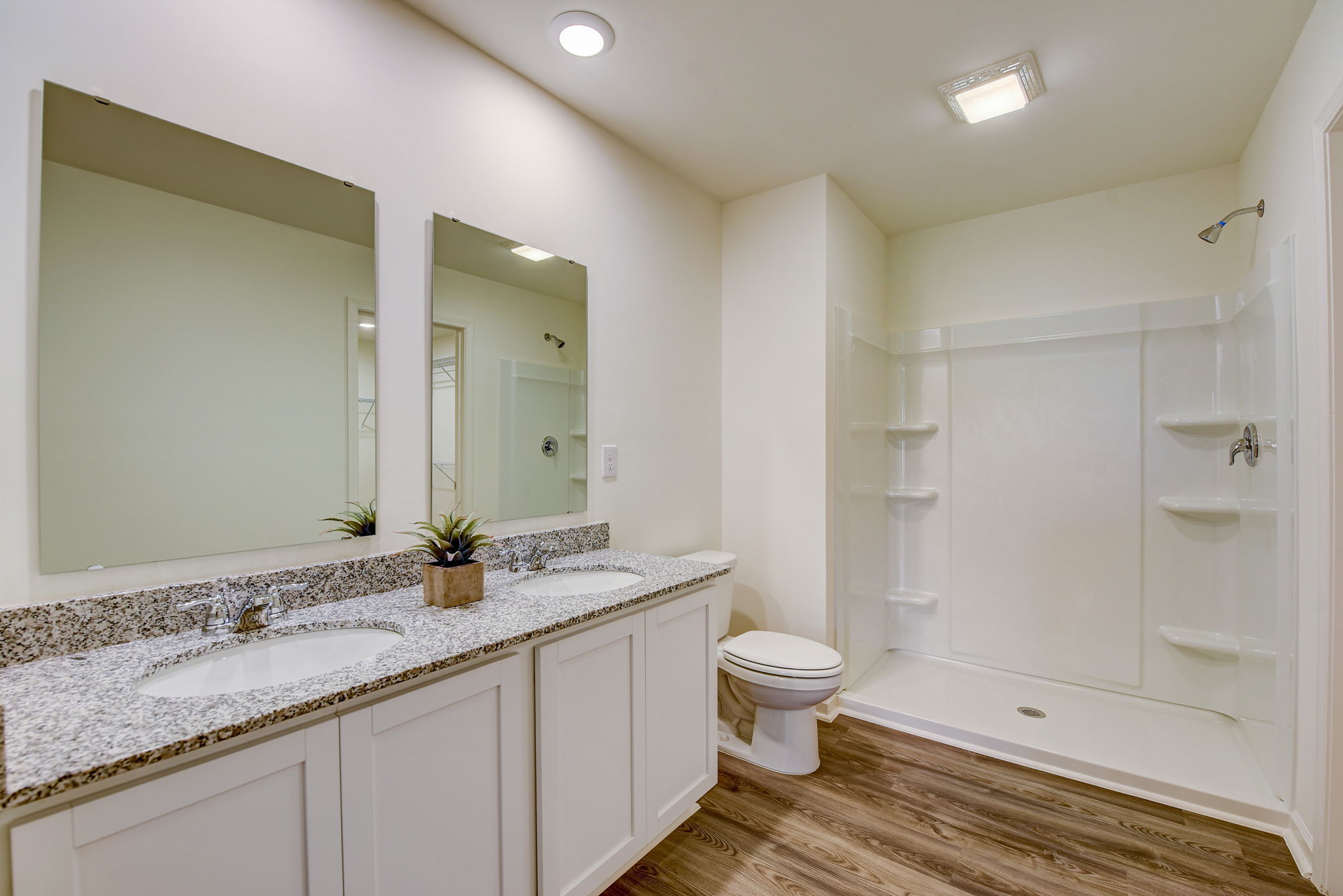 A bathroom with a marble countertop.