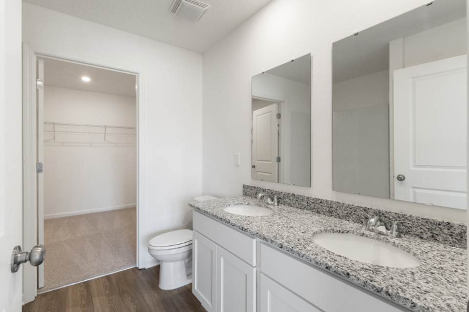 A bathroom with a marble countertop.