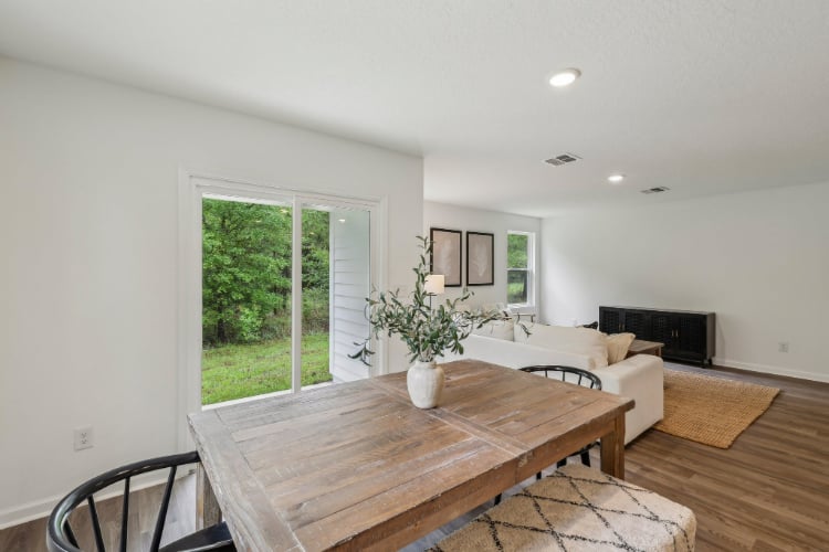 A living room with a table and couches.