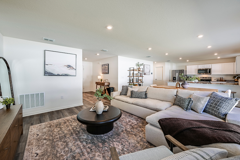 A large living room with a couch and a coffee table.