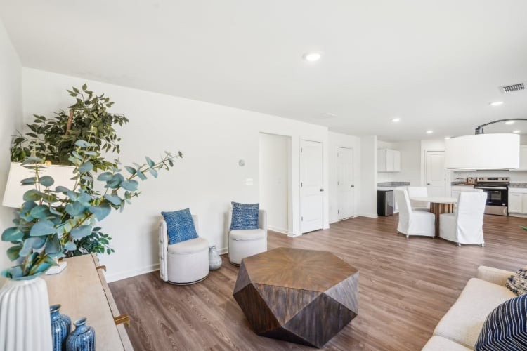 A living room with white walls.