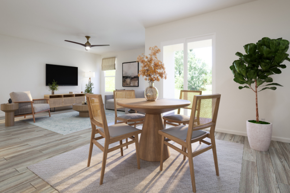 A dining room with a table and chairs.