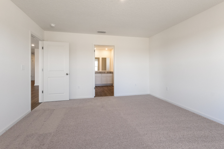 A hallway with white doors.