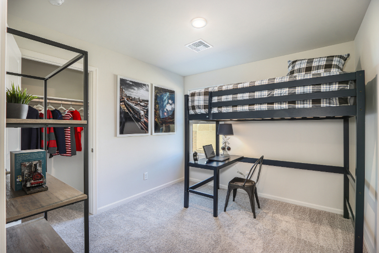 A room with a desk and a chair.