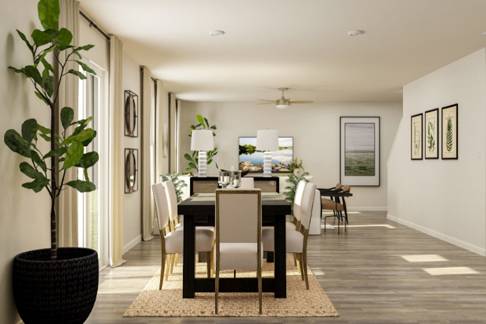 A dining room with a table and chairs.