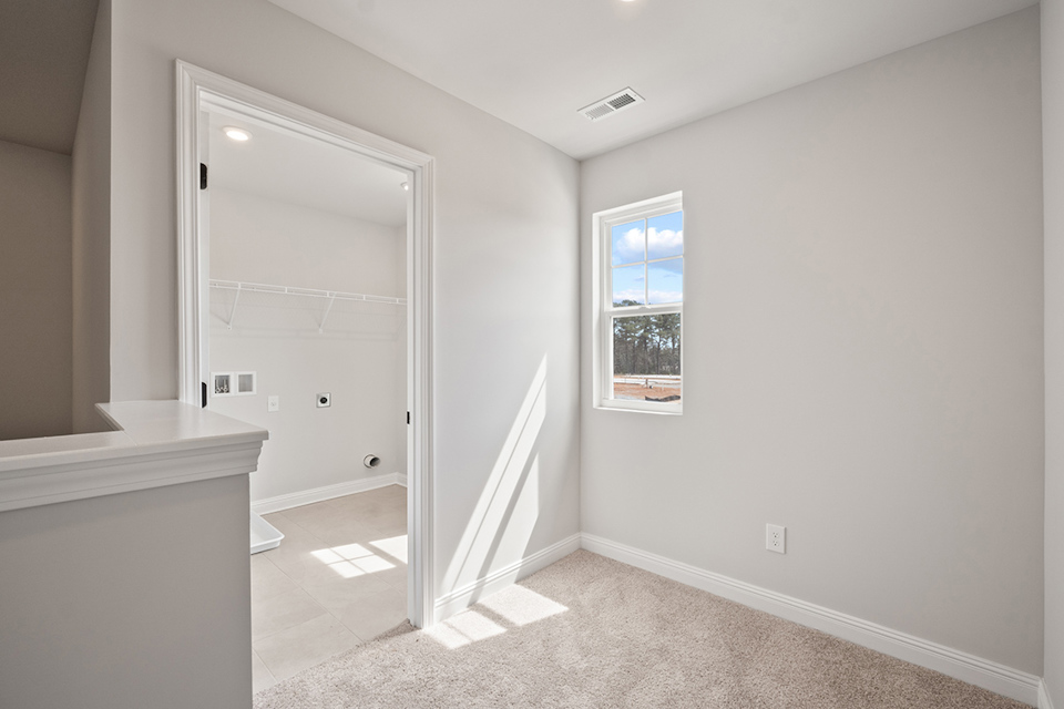 A bathroom with a shower unit.