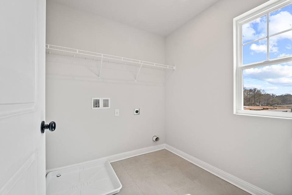 A white room with a window.
