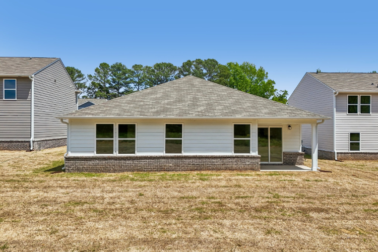A house with a grass yard.