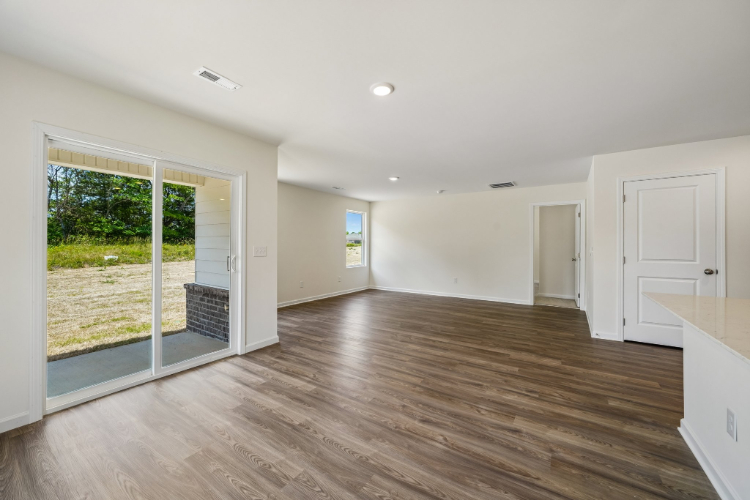 A room with a wood floor and a wood floor.