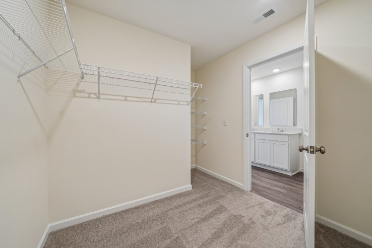 A hallway with white walls.