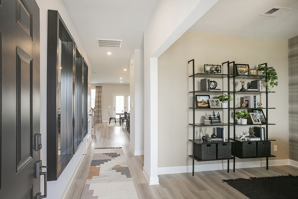 A room with shelves and a table.