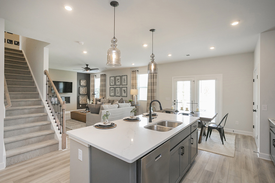 A kitchen with a large white island.