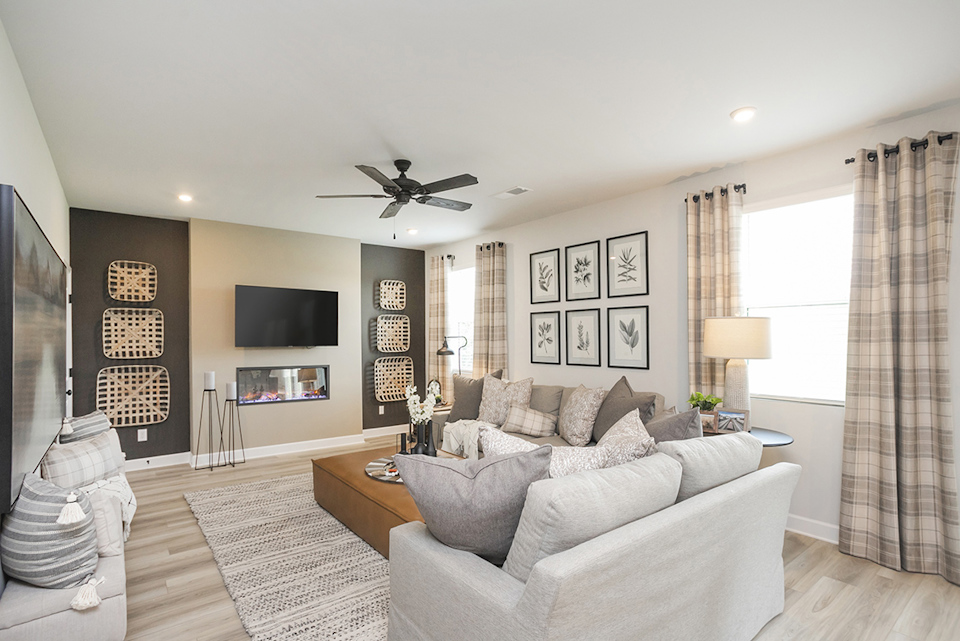 A living room with a couch and a tv.