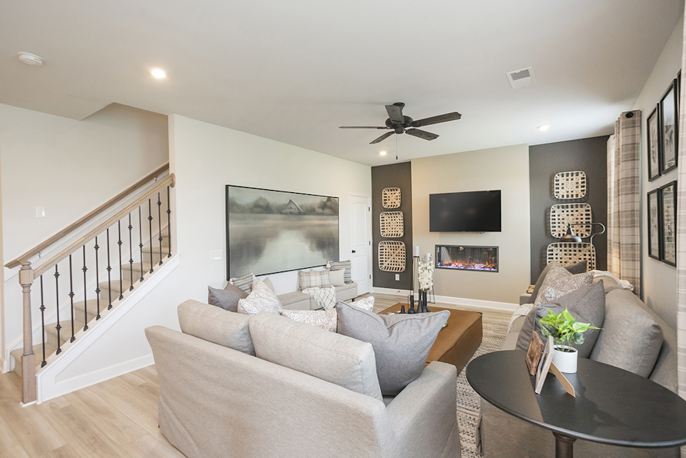 A living room with a couch and a table.