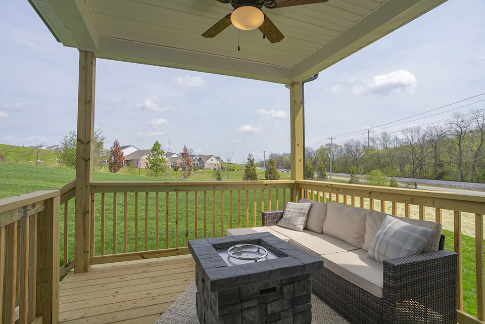 A couch on a deck.