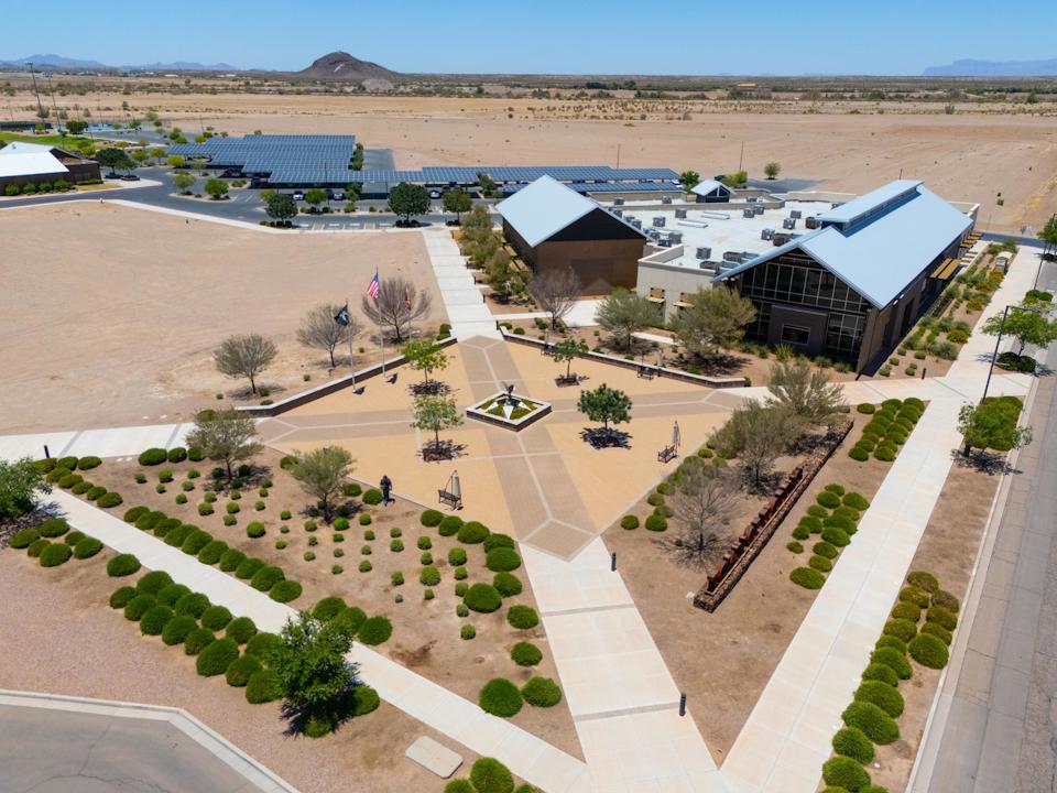 A large building with a parking lot.