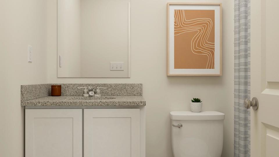 A bathroom with a sink and a toilet.