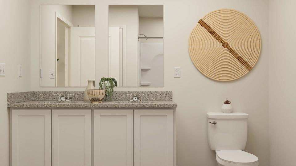 A bathroom with a large mirror.
