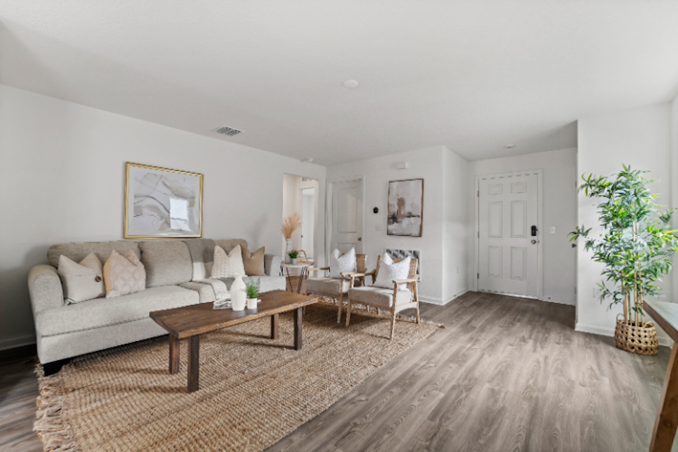 A living room with a couch and a coffee table.