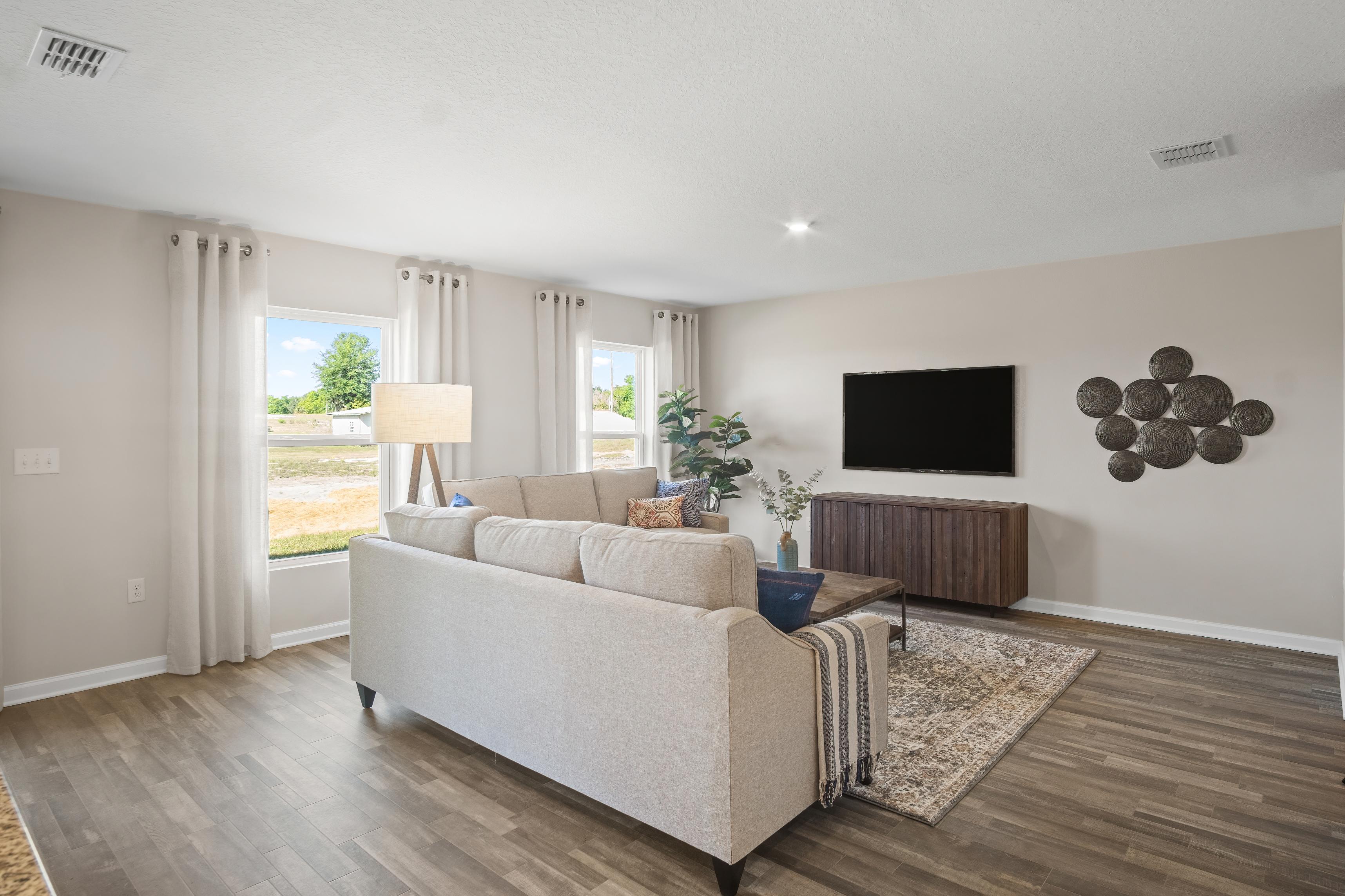 A living room with a large tv.