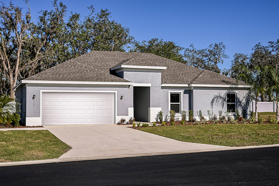 A house with a garage with Mission House in the background.