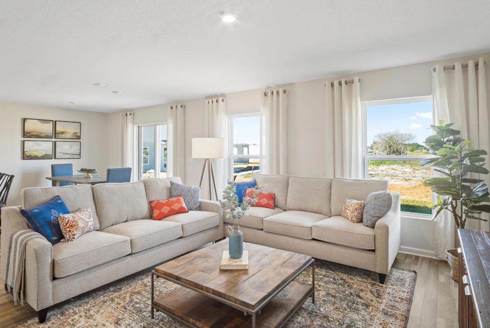 A living room with a couch and a coffee table.