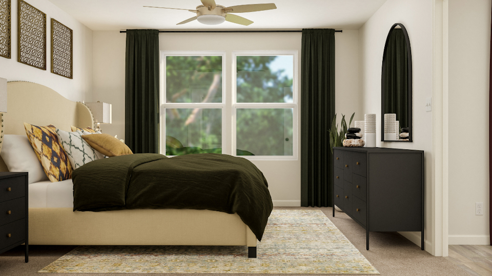 A bedroom with a bed and a window.