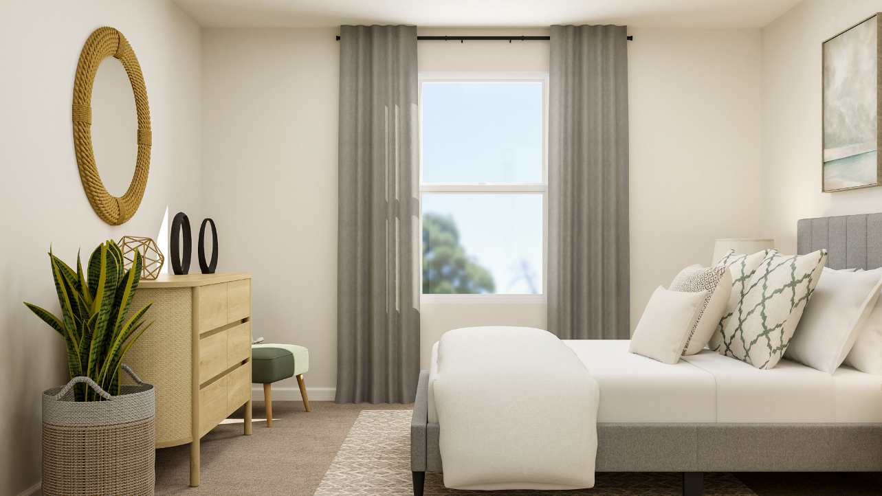 A living room with a white couch and a white chair.