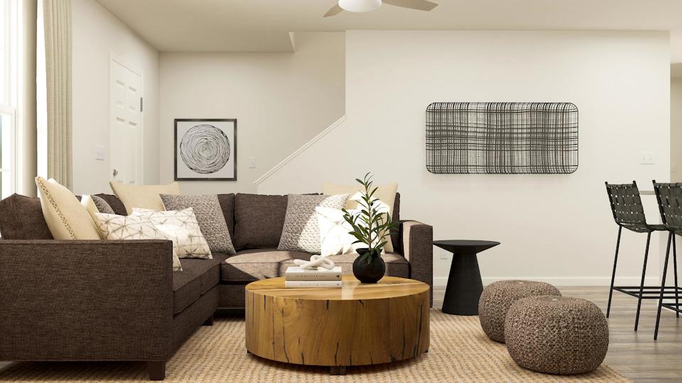 A living room with a couch and coffee table.