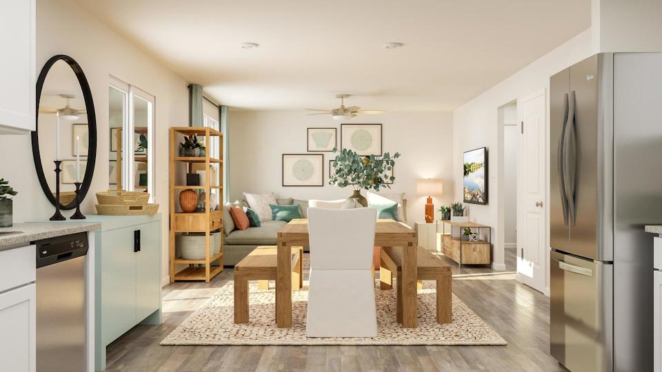 A living room with a table and a couch.