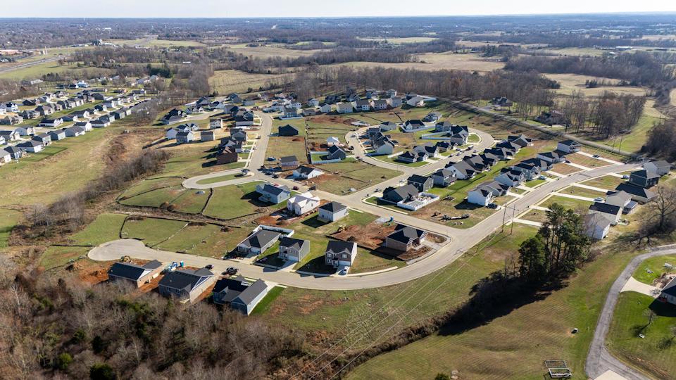A group of houses in a field.