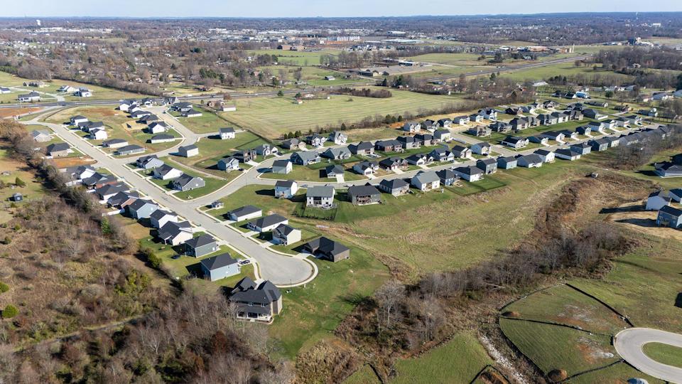A group of houses in a field.
