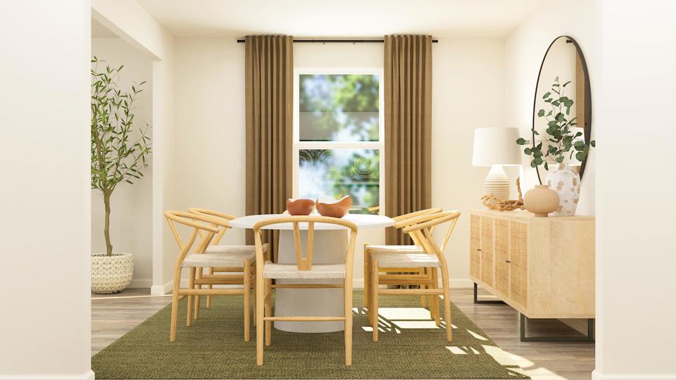 A dining room with a table and chairs.