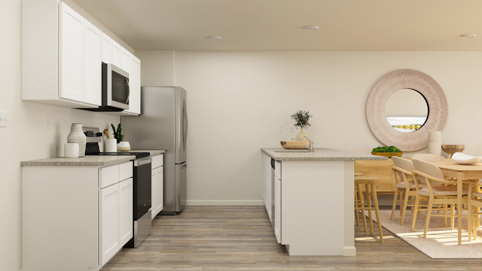 A kitchen with white cabinets.