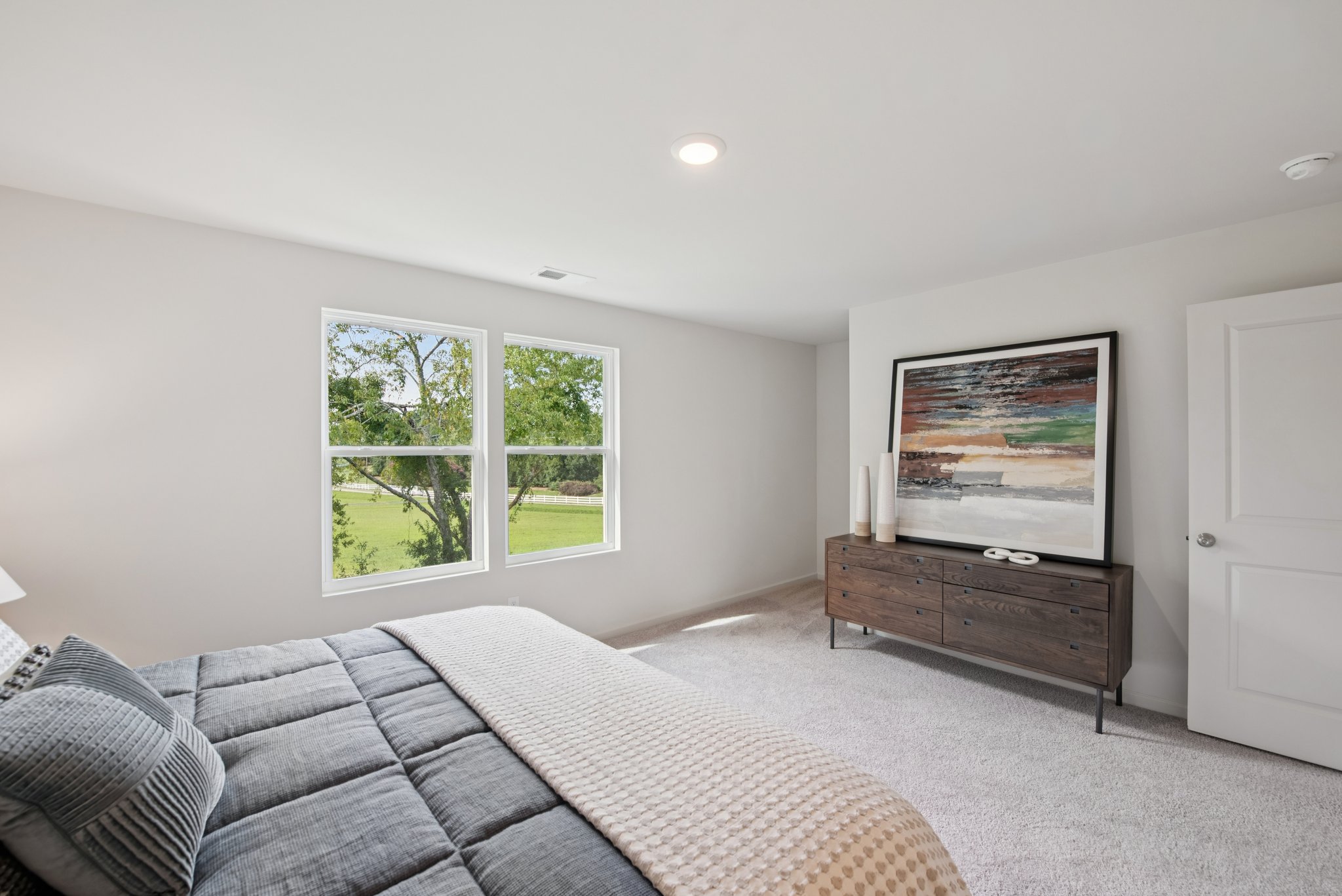 A room with a bed and a window.