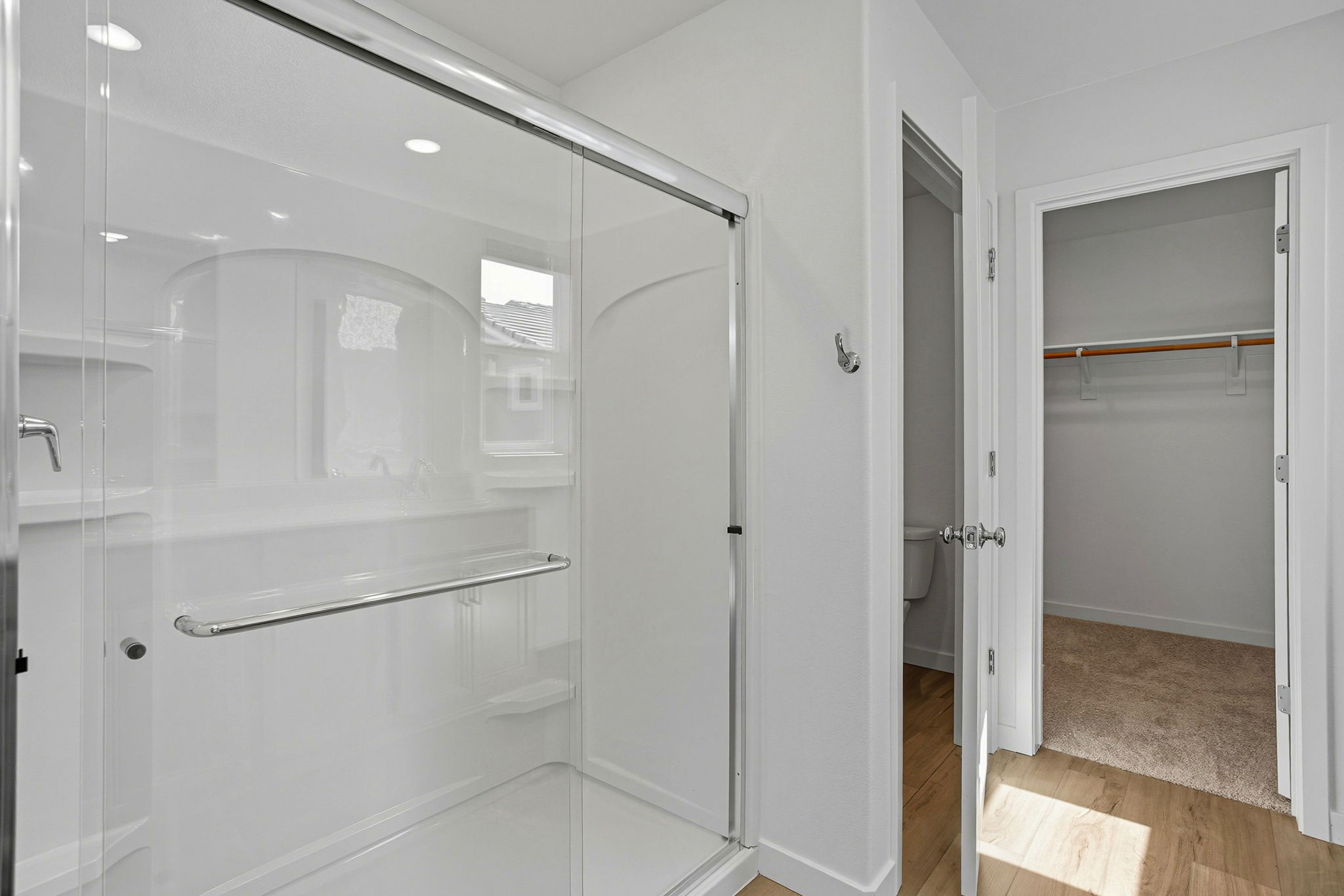 A bathroom with a glass shower.