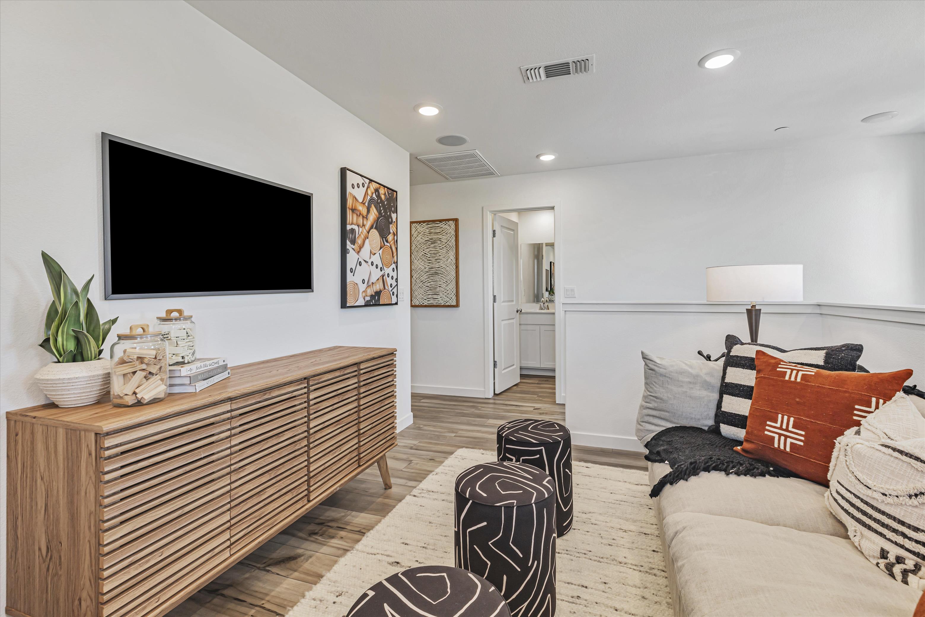 A room with a bed and a tv.